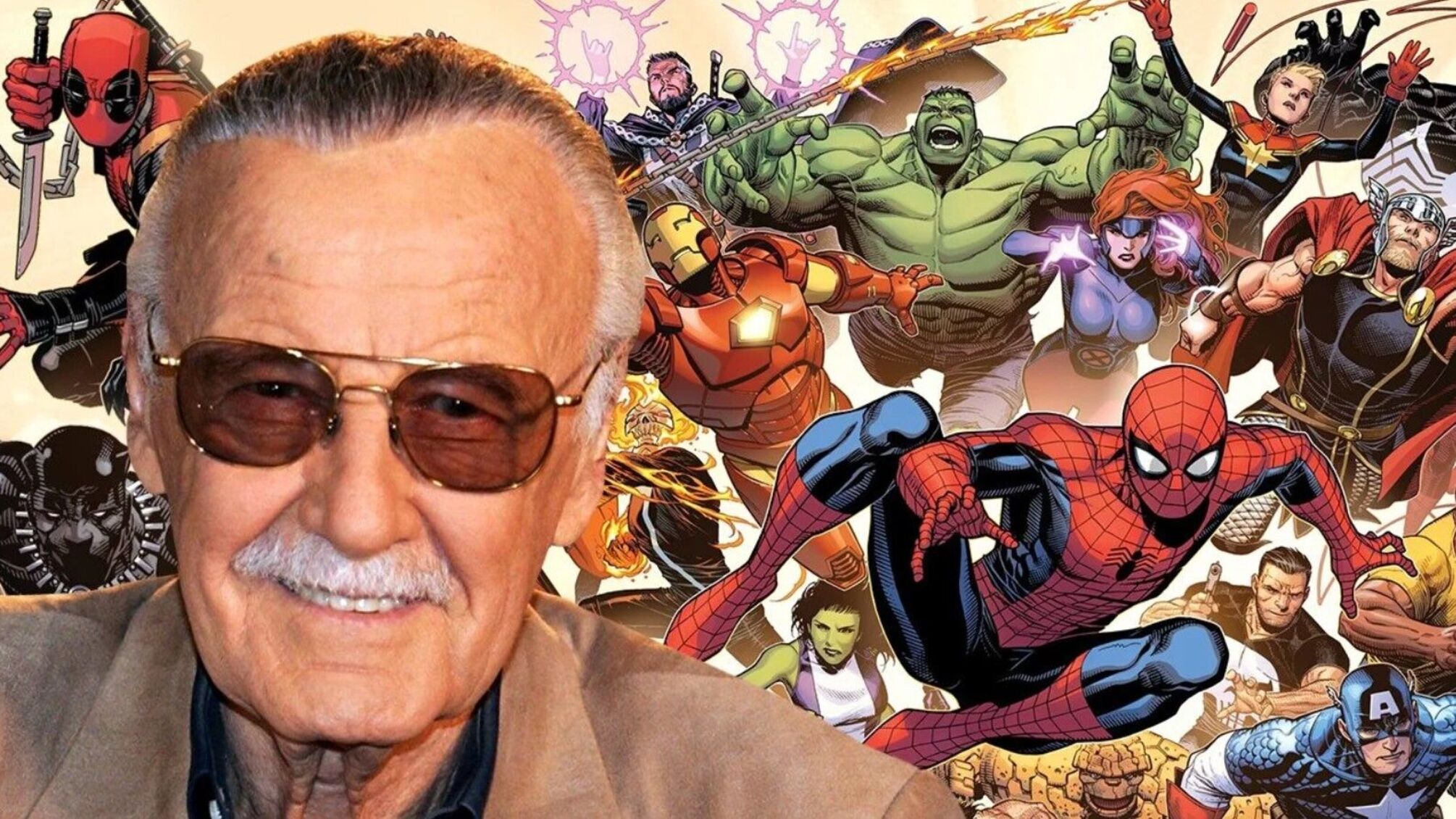 Cтен Лі - на тлі постера з героями світу Marvel